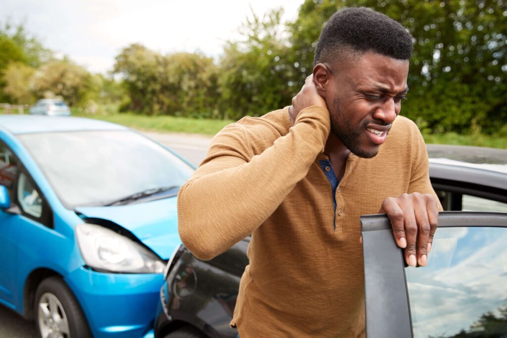 Image of man with neck pain after a car accident